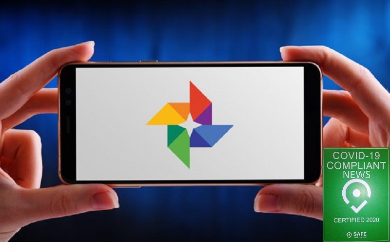 POZNAN, POL – MAY 21, 2020: Hands holding smartphone displaying logo of Google Photos, a photo sharing and storage service developed by Google